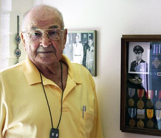 Salutes patient with service medals