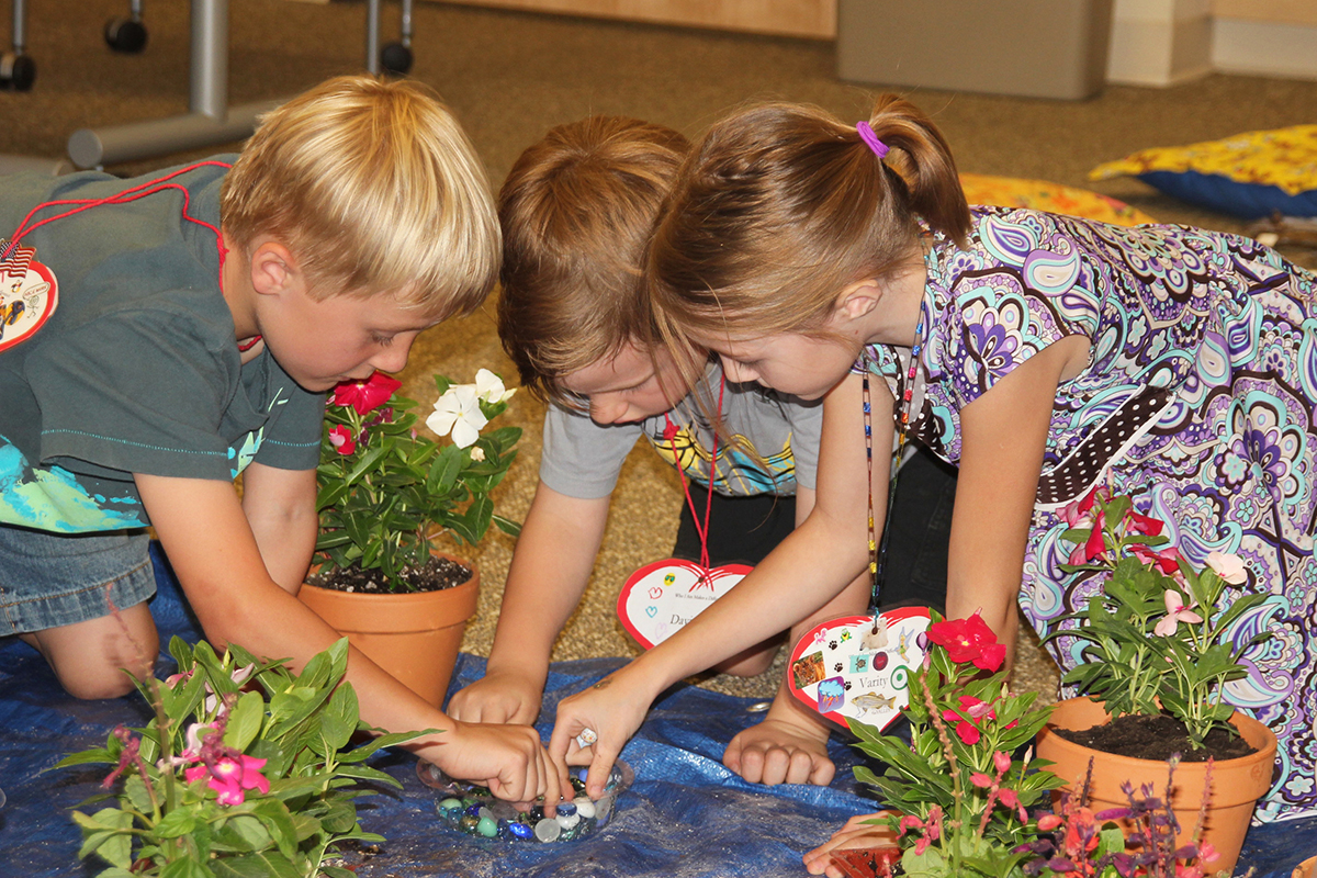 New Song Center children work on a healing project together