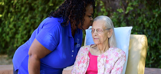 Volunteer singing to patient