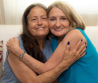 Volunteer Betty Schecker supporting Darlene Ferjak with full-time caregiving