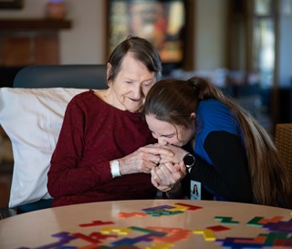 CNA Kalyana Wright helped care for patient Mary Perazzoli at Gardiner Home