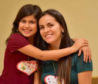 Mother and daughter hugging