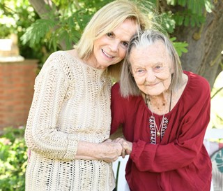 Patient and caretaker holding hands