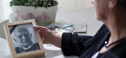 Wife grieving husband in photo