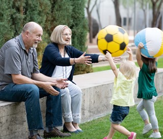 Grandparents play ball with children