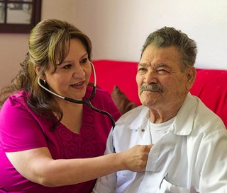 Hispanic nurse and male patient