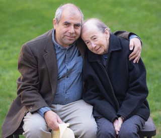 Dementia patient being hugged by family member