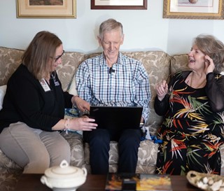 Patient Eamon Treanor and his wife Pat, with social worker, Callie Dettinger watching video