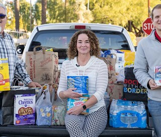 Sandpiper community holiday food drive. Maggie Martel with Facilities team, Joe Campaigne (left) and Jace Orcutt