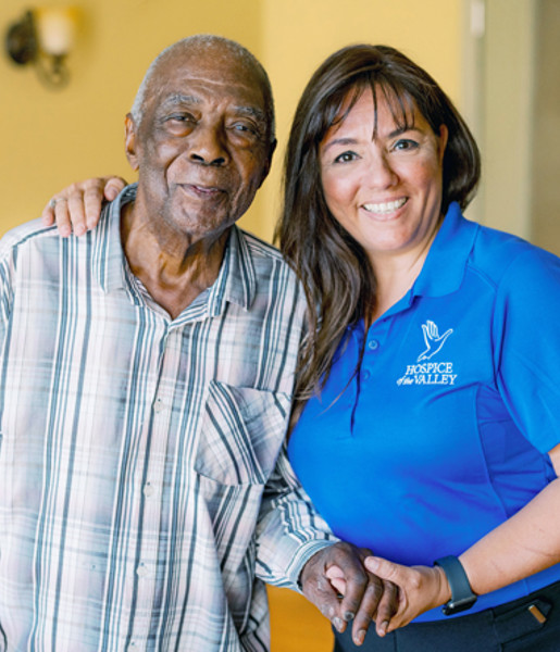 Social worker Marcela Vazquez Bowler visiting with patient Lucius